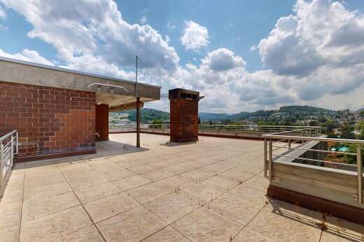 terrace with a patio and a mountain view