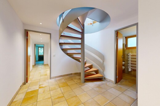 stairs featuring tile patterned flooring and recessed lighting