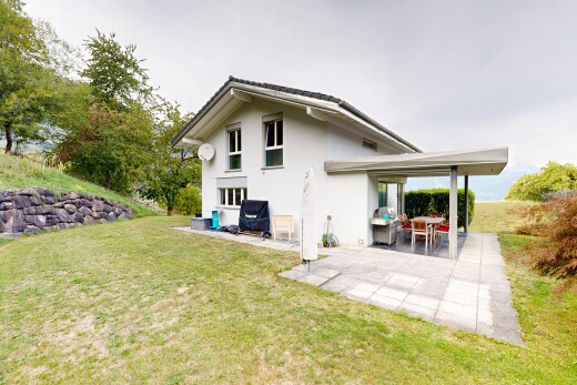 außenansicht mit rasen, from property, property visible, stuckverkleidung, und terrasse