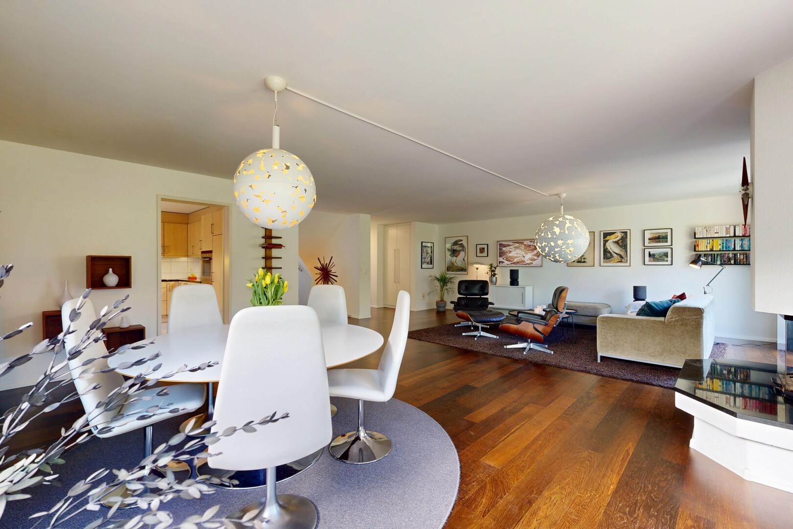 living room featuring wood finished floors and hanging lights