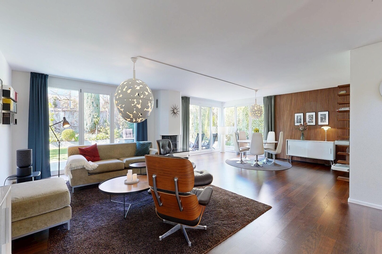 living area with a chandelier and dark wood-style flooring