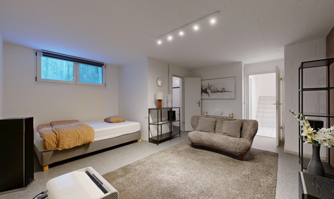 room / bedroom with carpet floors and track lighting