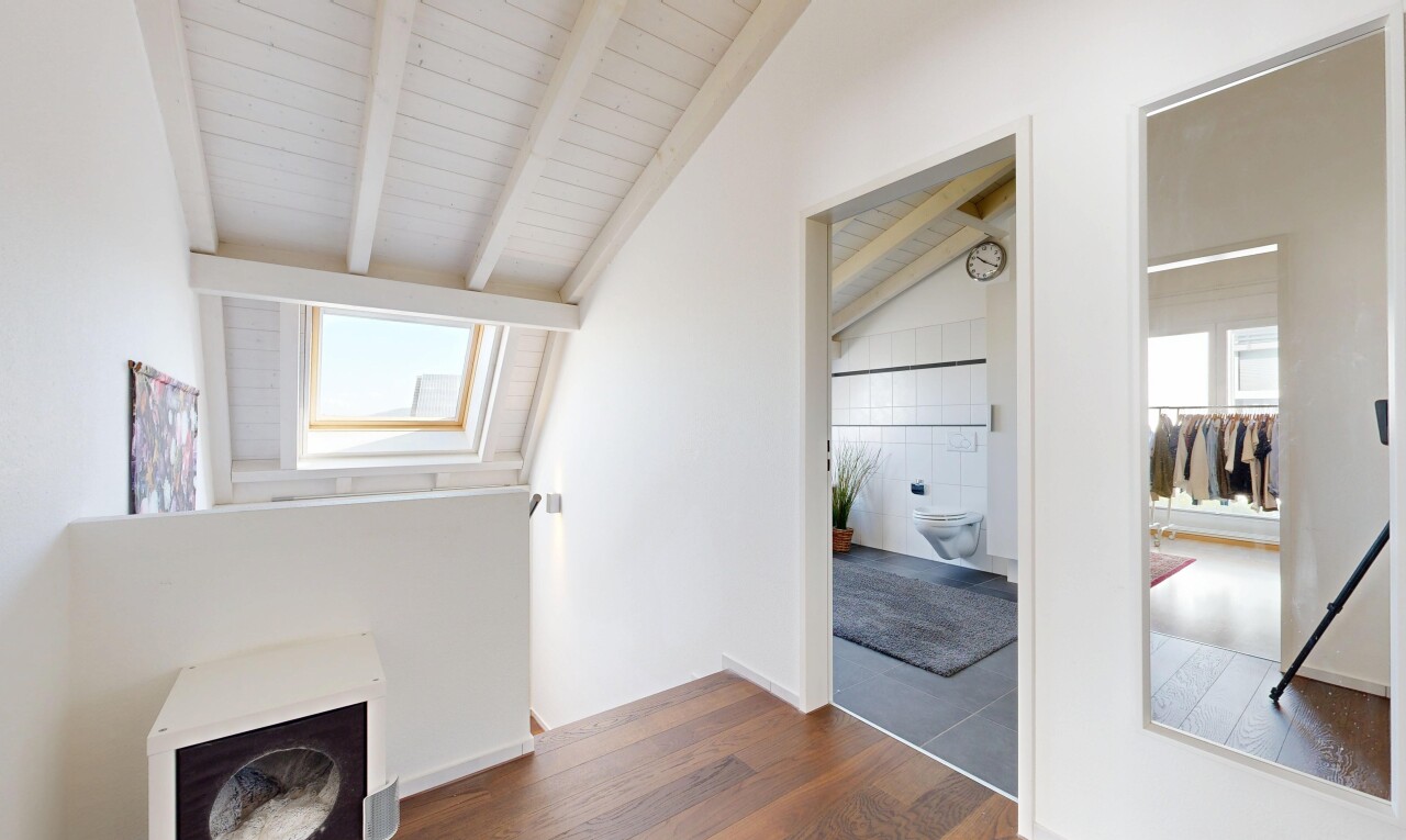 empty room featuring dark wood-type flooring and lofted ceiling with beams