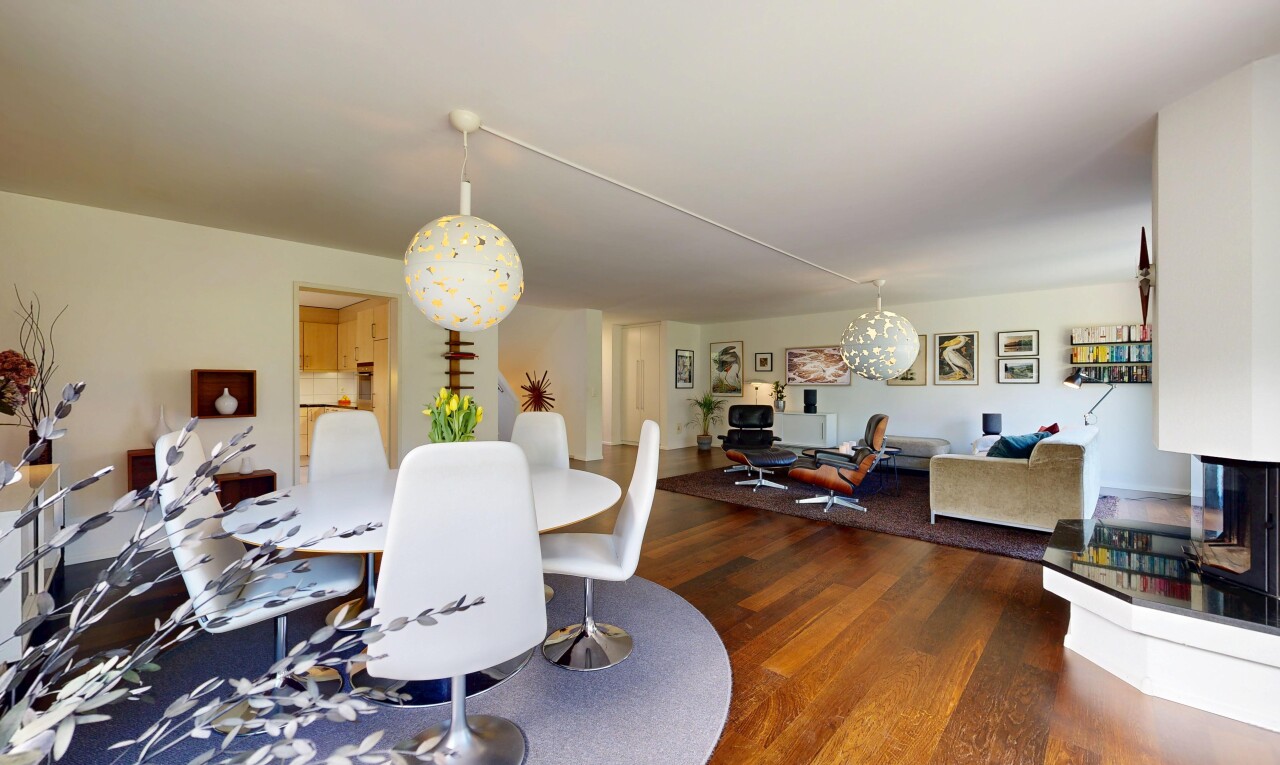 living room featuring wood finished floors and hanging lights