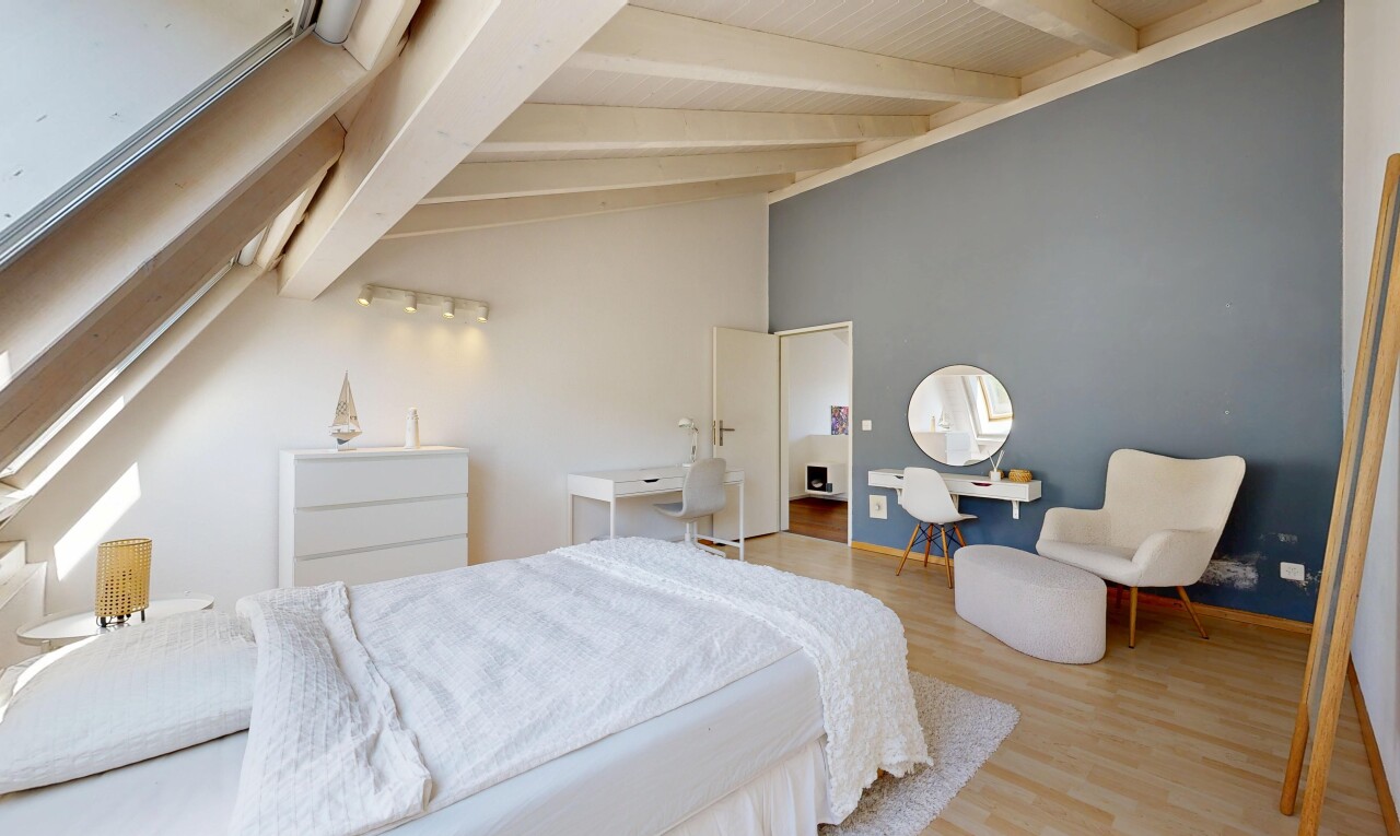 room / bedroom with light wood-style flooring and vaulted ceiling with beams