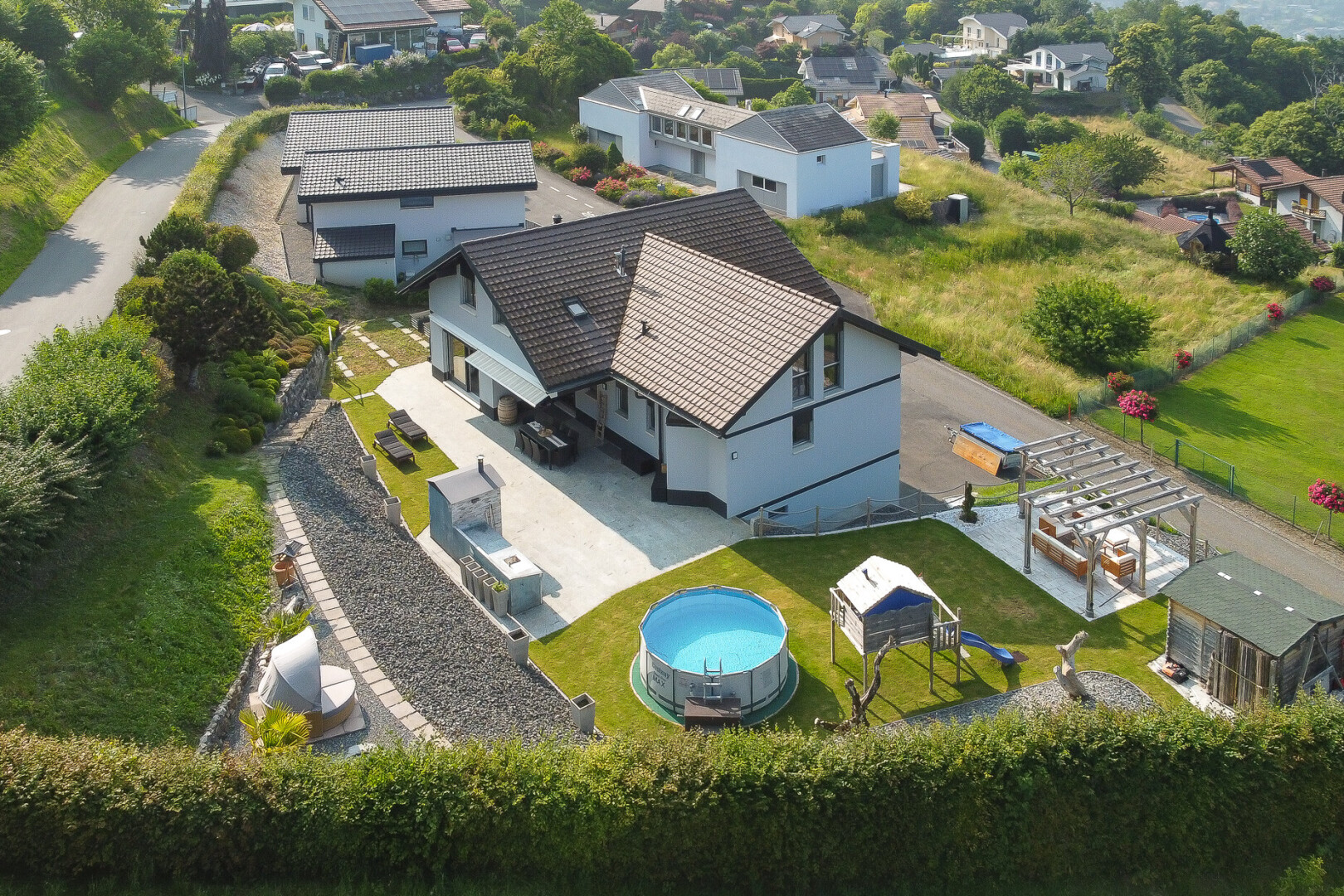 view of home featuring a residential view, a patio, and an outdoor pool