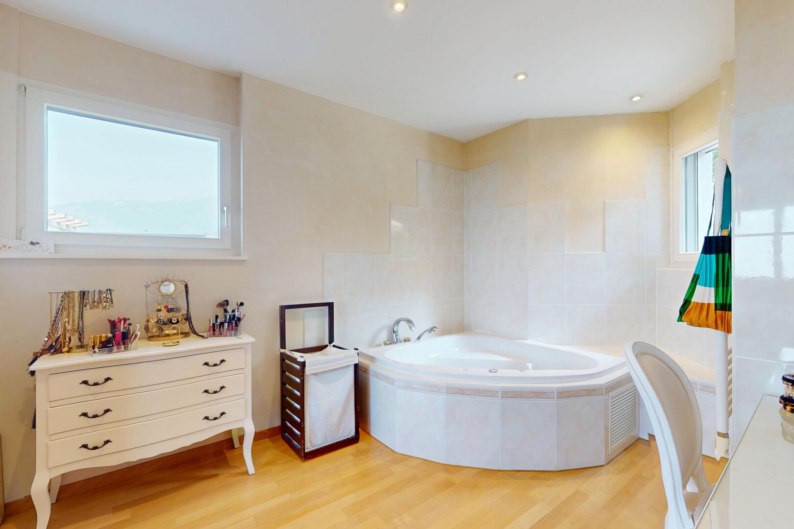 full bathroom featuring a garden tub and wood finished floors