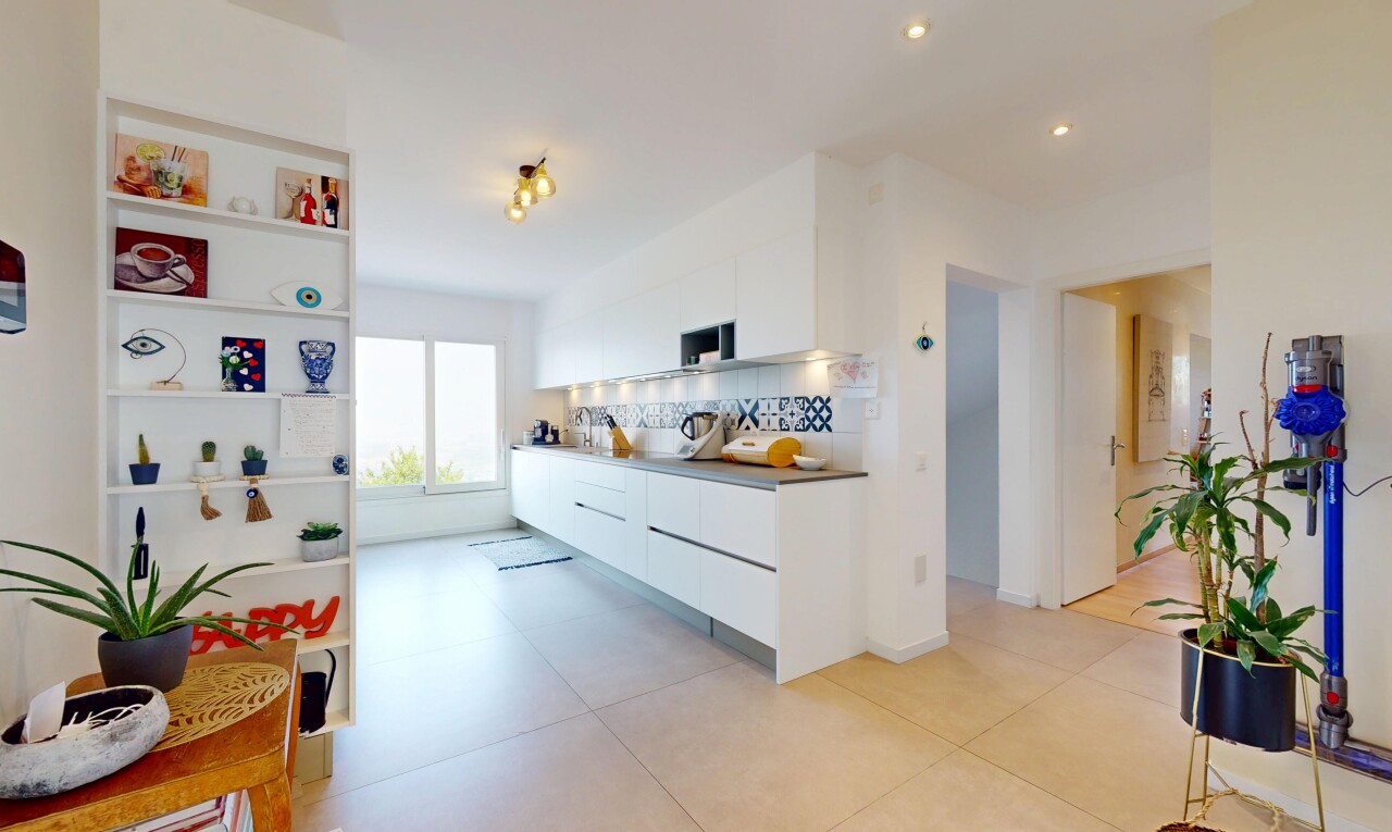 kitchen with modern cabinets, white cabinetry, tasteful backsplash, and recessed lighting
