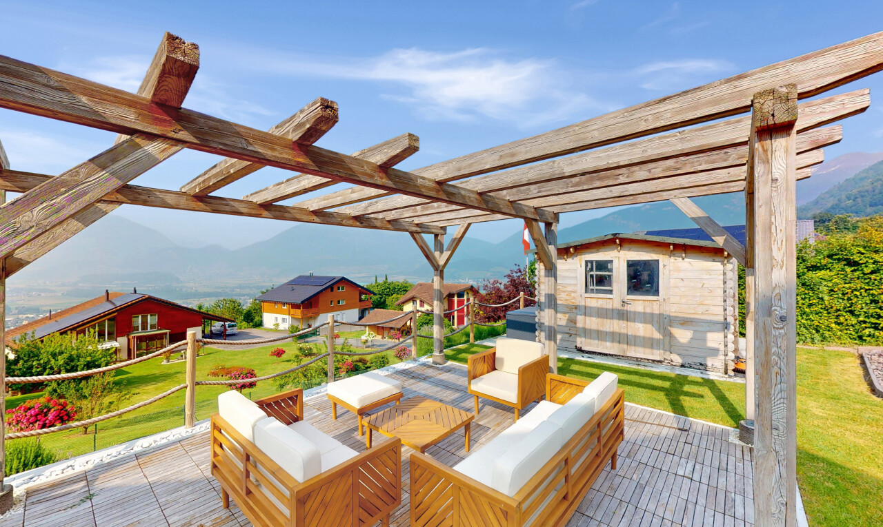 terrace with a pergola, an outdoor hangout area, and a deck with mountain view