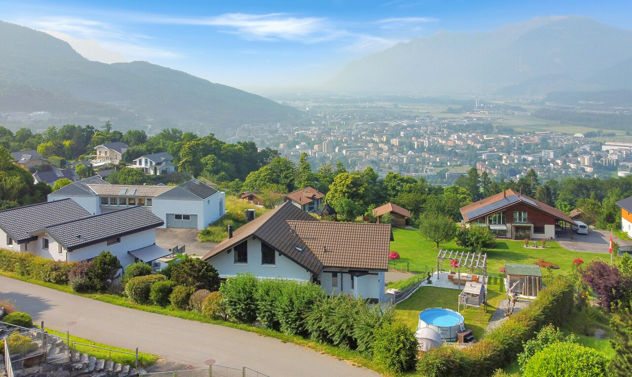 view of home with a mountain view and a residential view