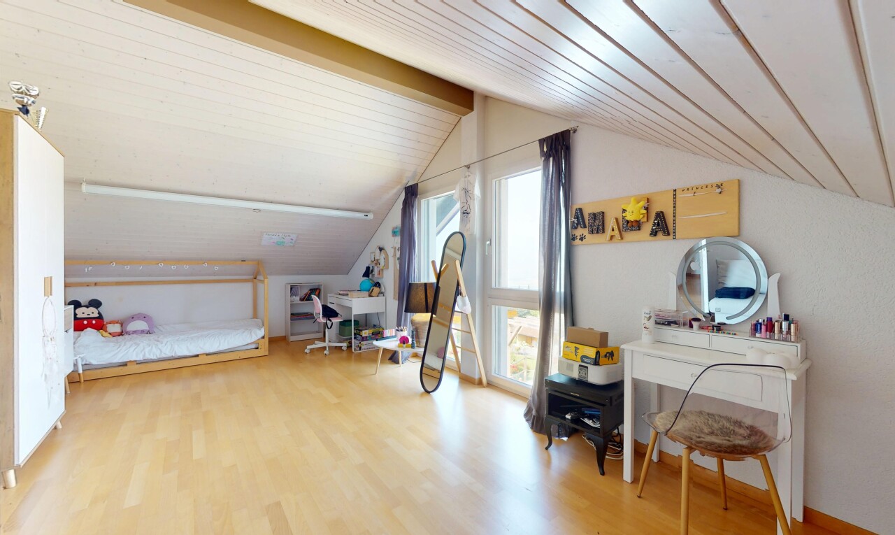 room / bedroom with vaulted ceiling and wood finished floors