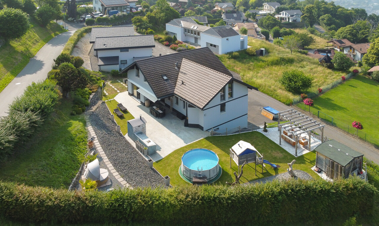 view of home featuring a residential view, a patio, and an outdoor pool