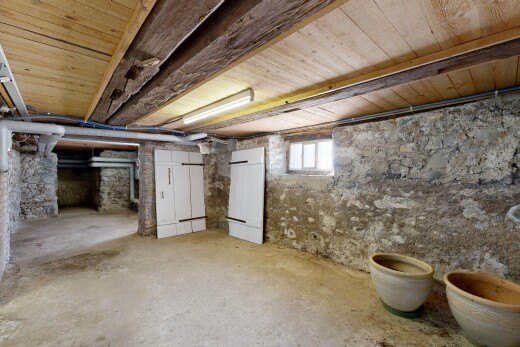 unfurnished room with unfinished concrete flooring