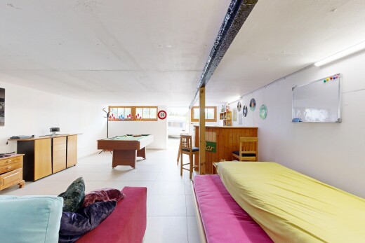 room with a dry bar and billiards table