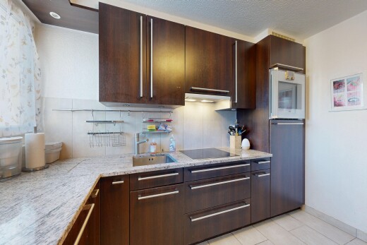 küche mit dark brown cabinets, dunkelbraune schränke, light countertops, drywall, und gipskartonwand