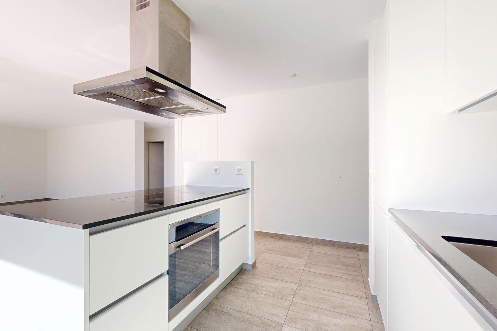 kitchen featuring modern cabinets, island range hood, white cabinets, and stainless steel oven