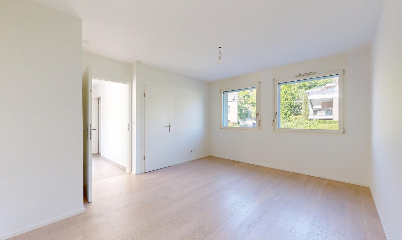 unfurnished room with light wood-style flooring