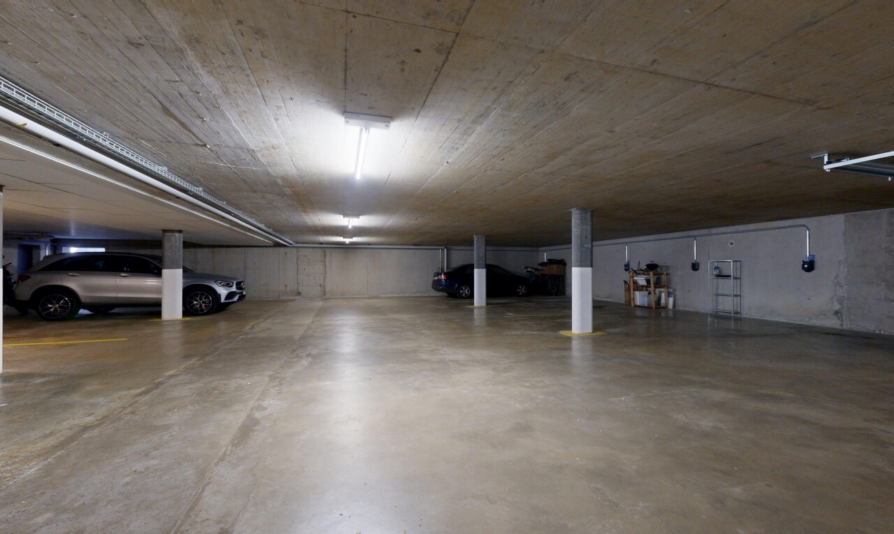 view of parking featuring a parking deck