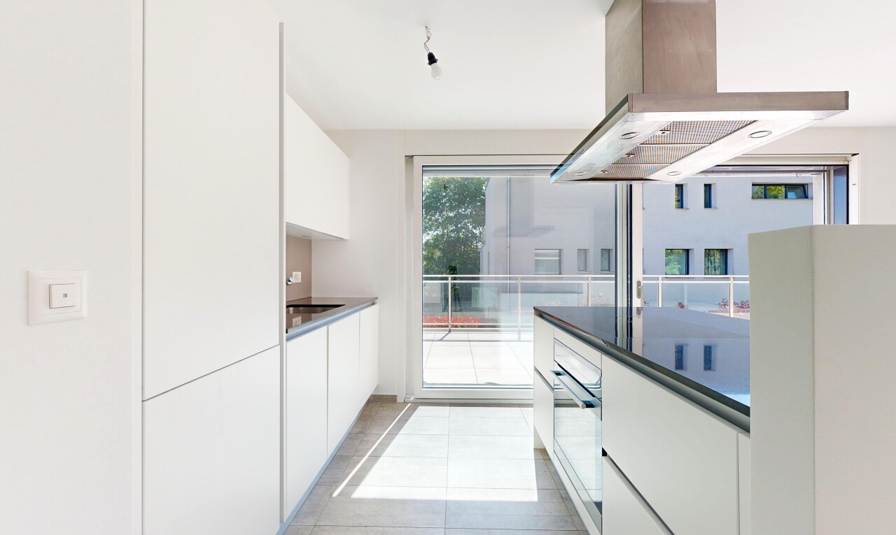 kitchen with modern cabinets, island exhaust hood, white cabinetry, oven, and light tile patterned flooring