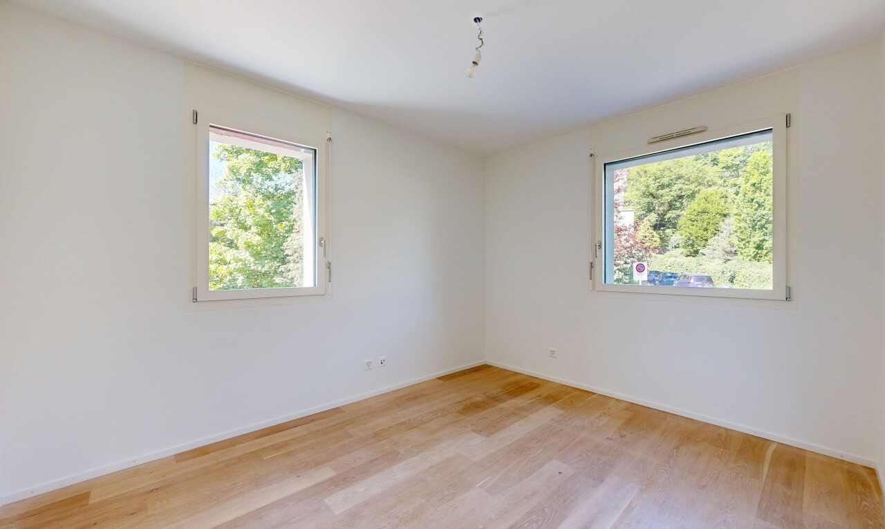 unfurnished room with light wood-type flooring