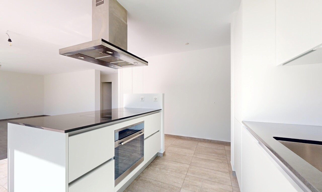 kitchen featuring modern cabinets, island range hood, white cabinets, and stainless steel oven