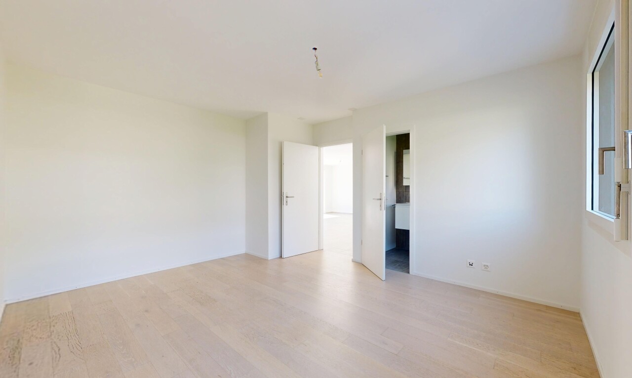 unfurnished room with light wood-style flooring