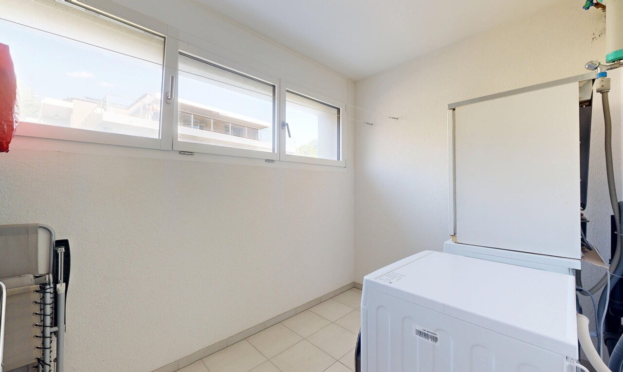 laundry area featuring washing machine and dryer and baseboards