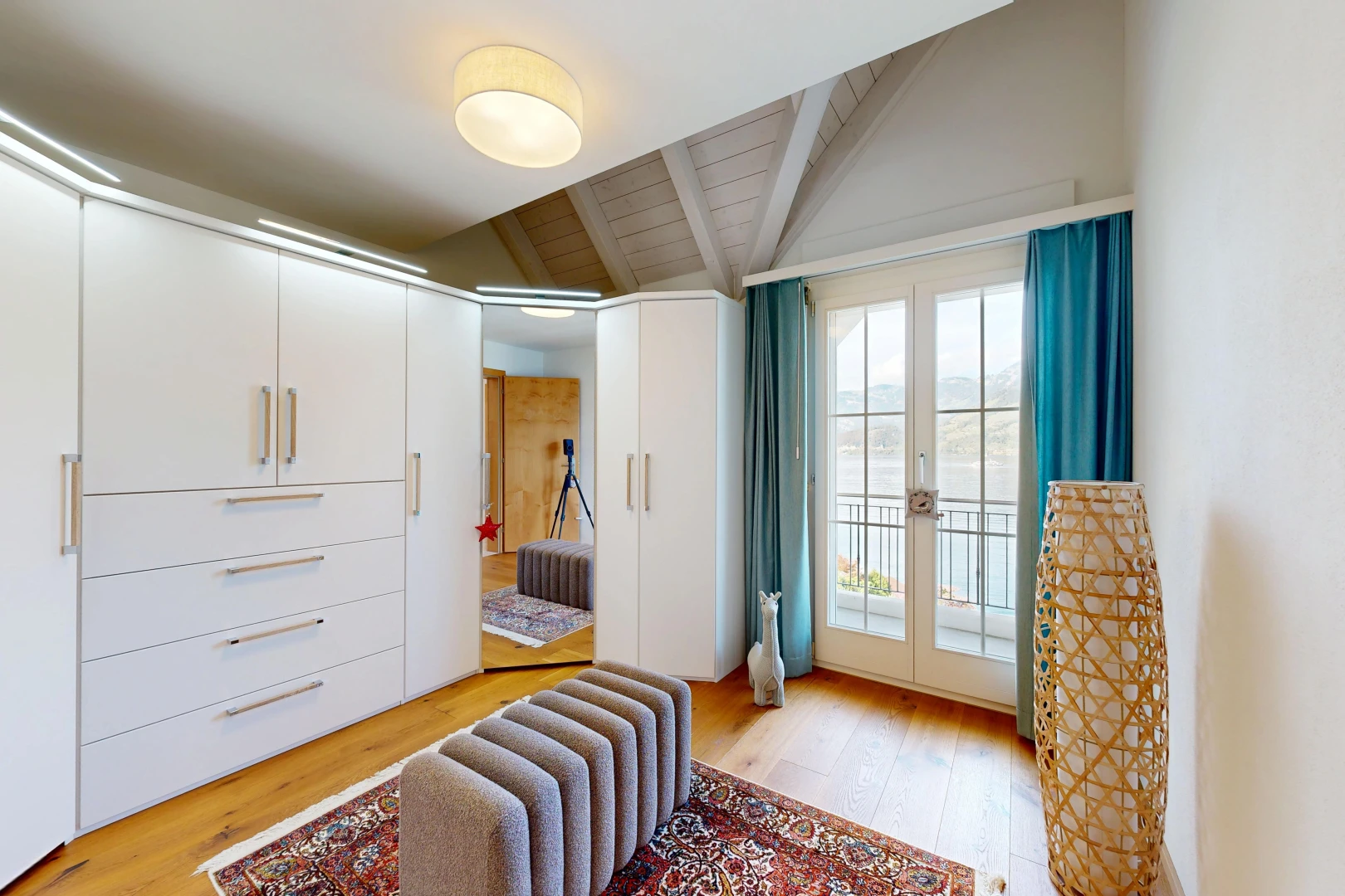 room / bedroom featuring access to exterior, light wood finished floors, french doors, and lofted ceiling