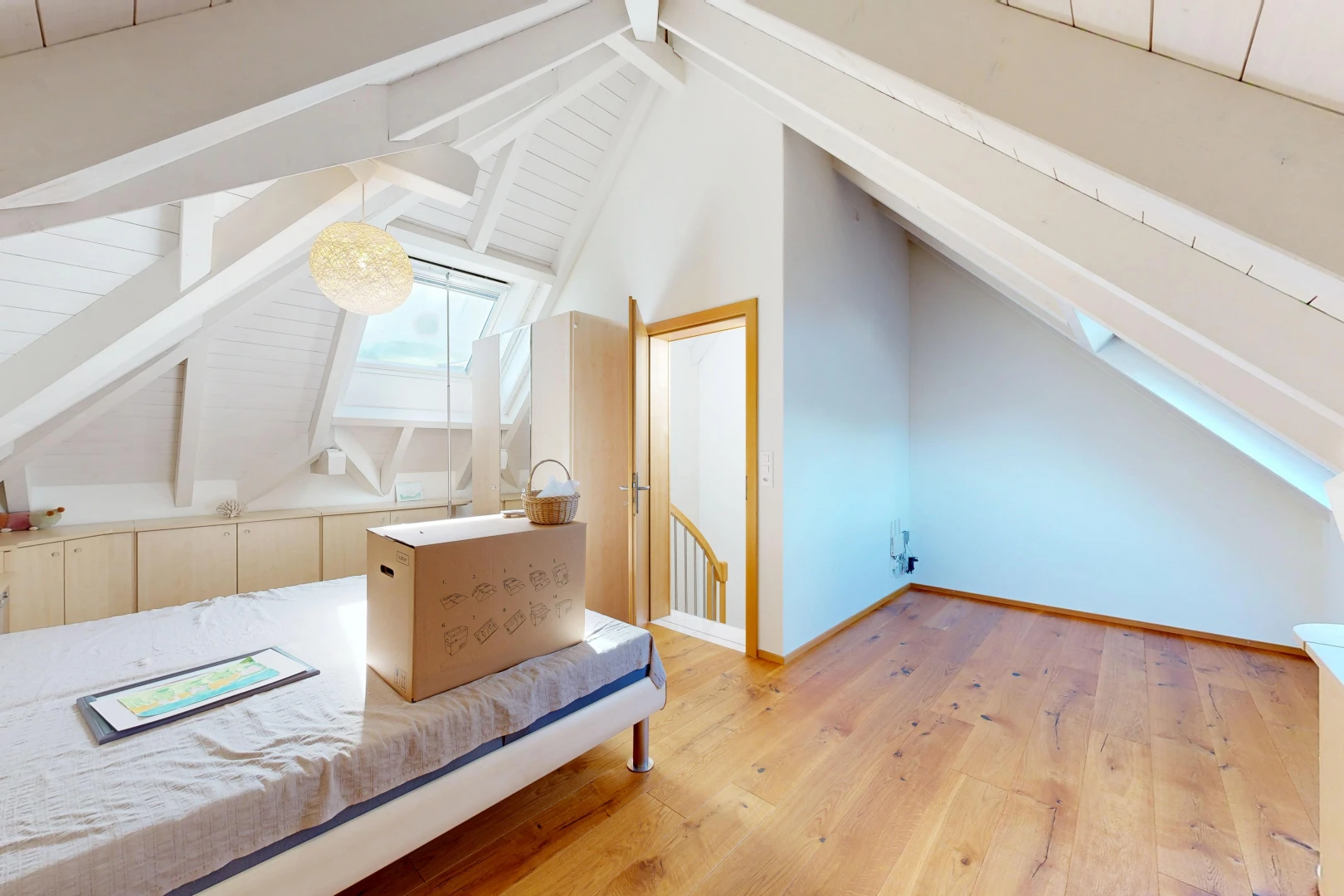 unfurnished room featuring lofted ceiling with beams and light wood-type flooring