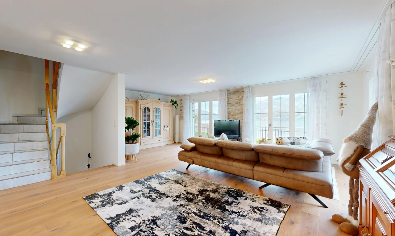 living area featuring stairway and light wood-style flooring