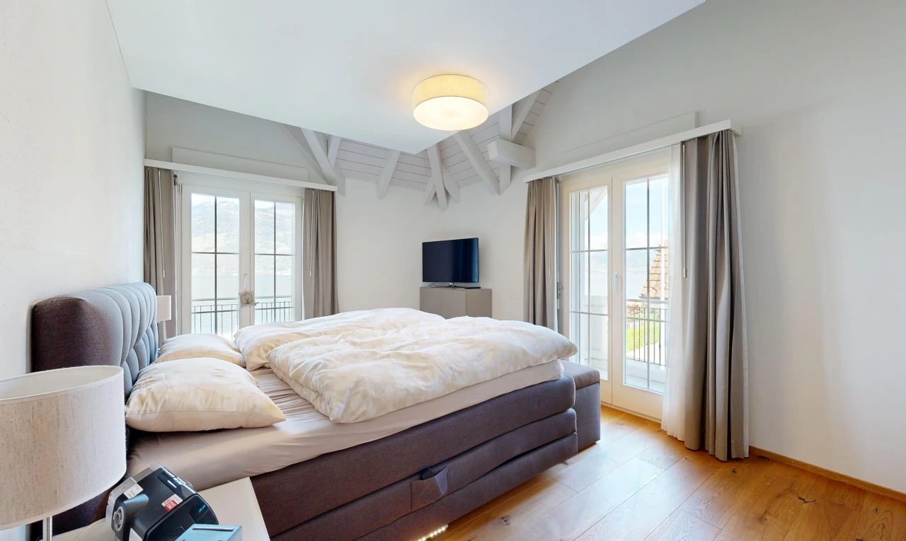 room / bedroom with access to exterior, light wood-type flooring, french doors, and vaulted ceiling