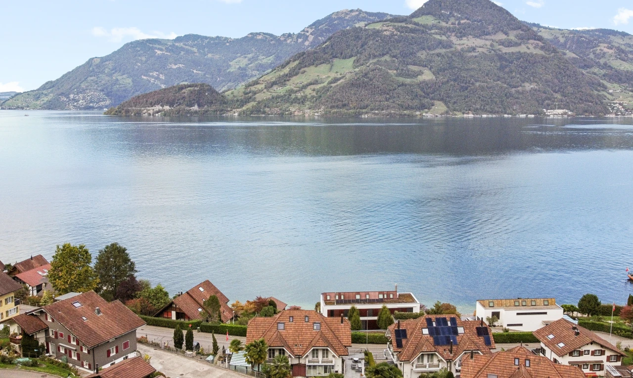 water view featuring nearby suburban area and a mountain backdrop