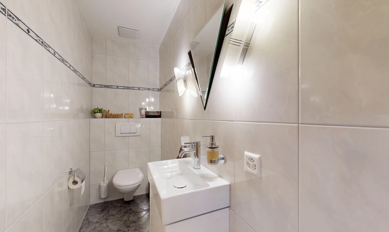 bathroom featuring tile walls and vanity