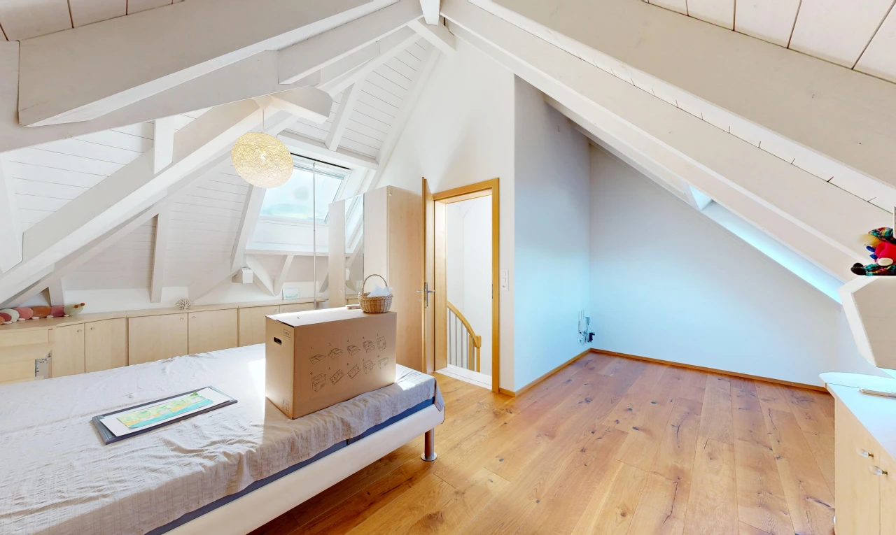 unfurnished room featuring lofted ceiling with beams and light wood-type flooring