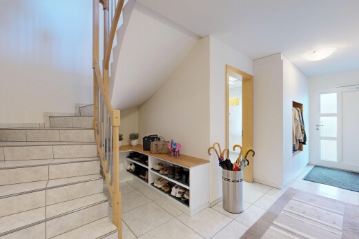 stairs with access to outside and light tile patterned floors