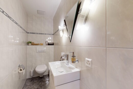 bathroom featuring tile walls and vanity