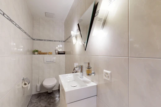 bathroom featuring tile walls and vanity