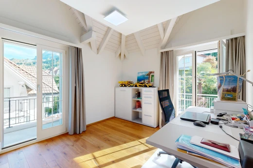 office with access to exterior, light wood-type flooring, and vaulted ceiling