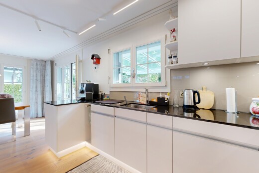 kitchen with white cabinets, open shelves, plenty of natural light, and light wood-style flooring