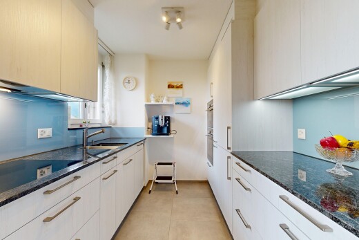 küche mit dark countertops, stein arbeitsplatten, stone countertops, light floor, und inside property