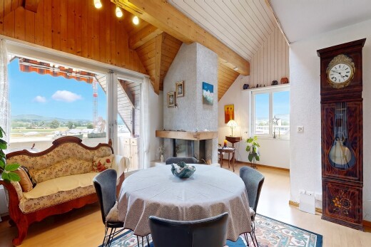 dining space with vaulted ceiling with beams, a multi sided fireplace, wood finished floors, and wood ceiling