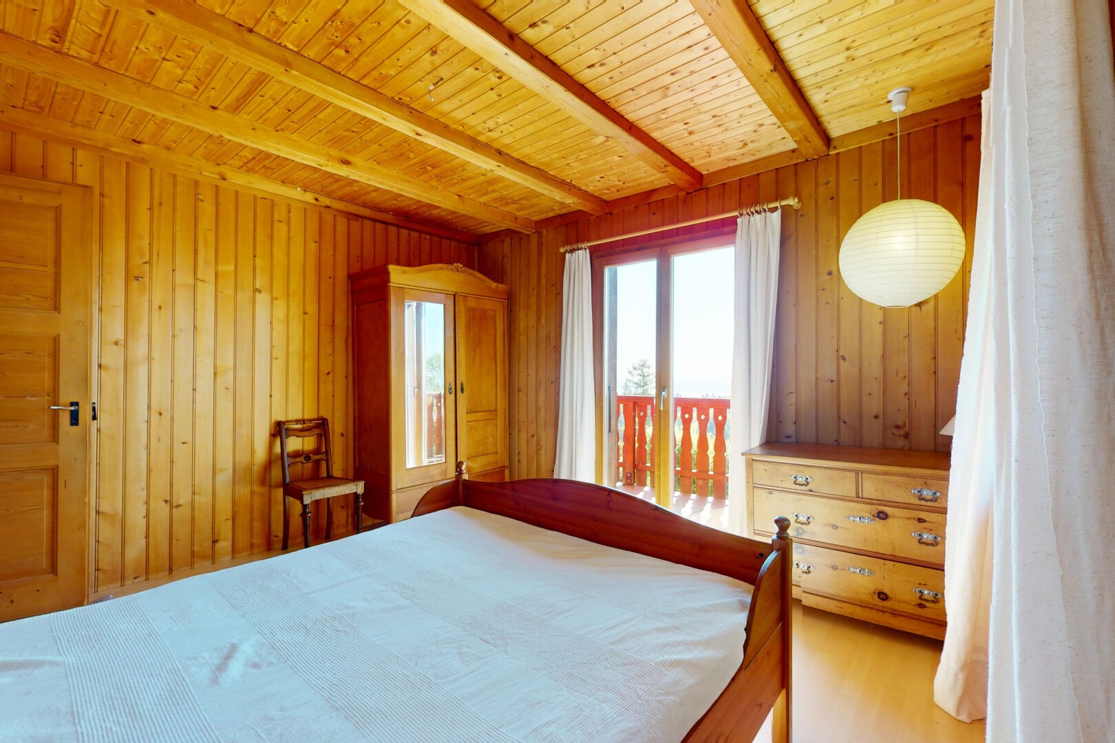 room / bedroom with wood walls and beamed ceiling