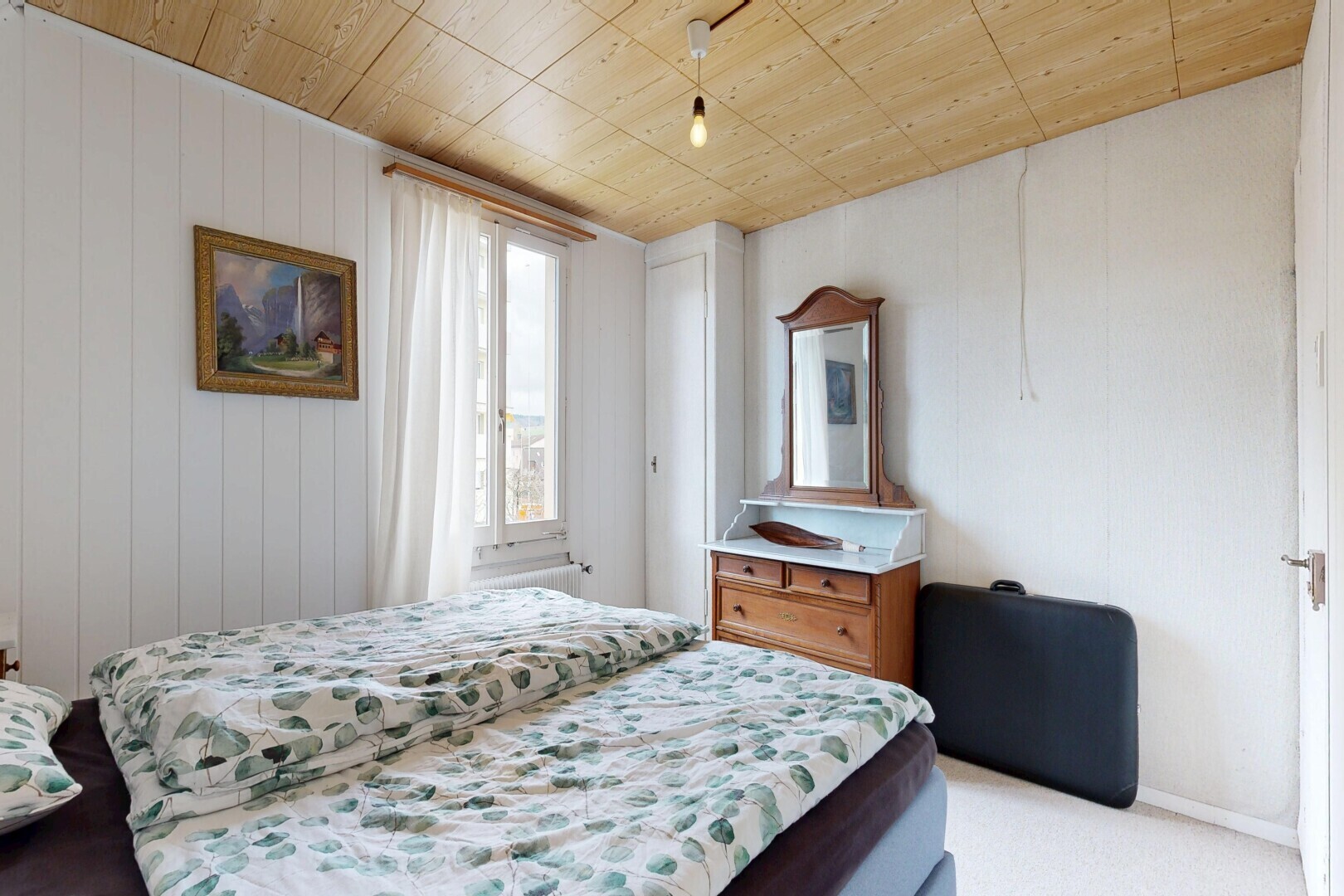 room with wooden ceiling and light carpet