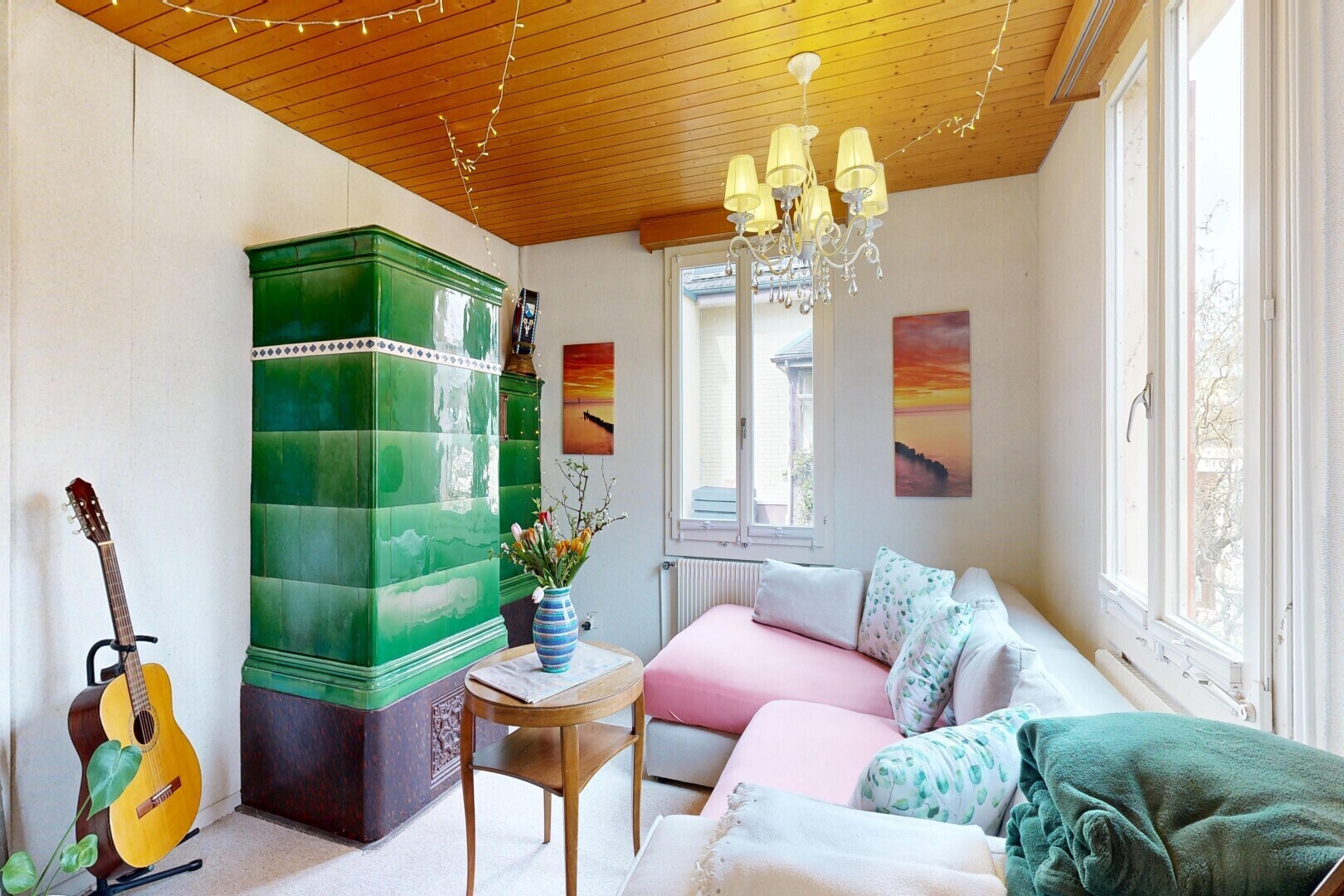 living room featuring a chandelier, wooden ceiling, and radiator