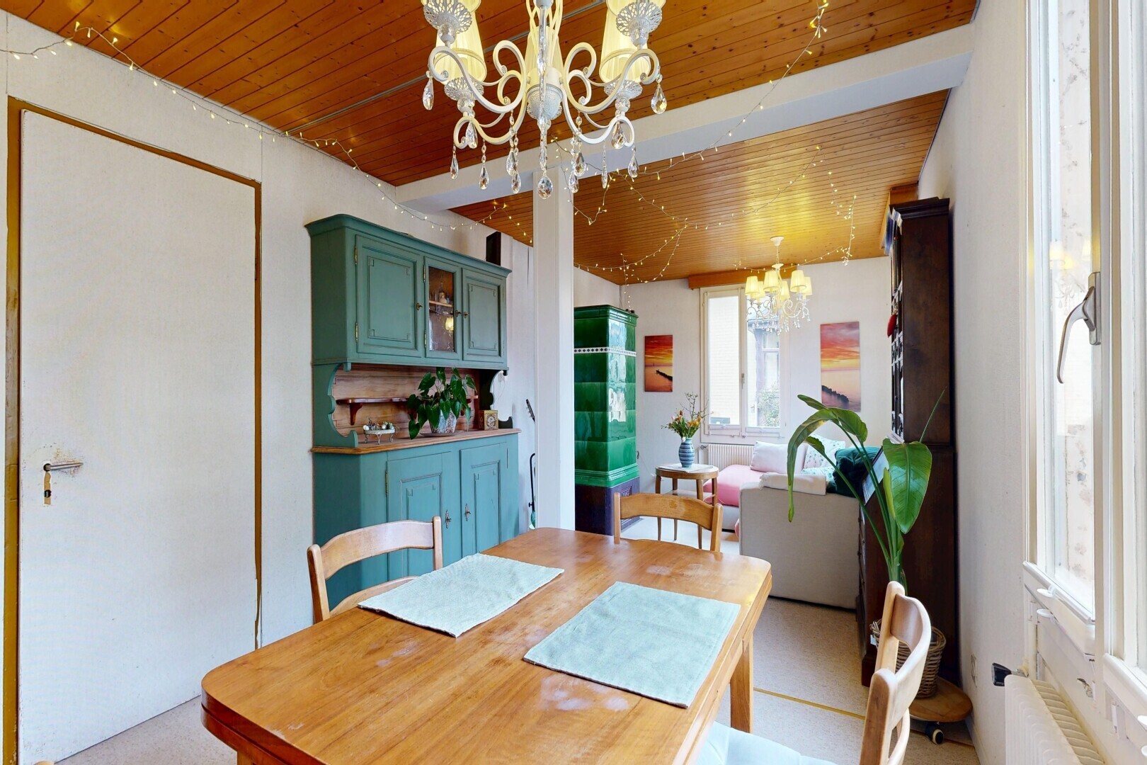dining room featuring hanging lights, wooden ceiling, and radiator heating unit