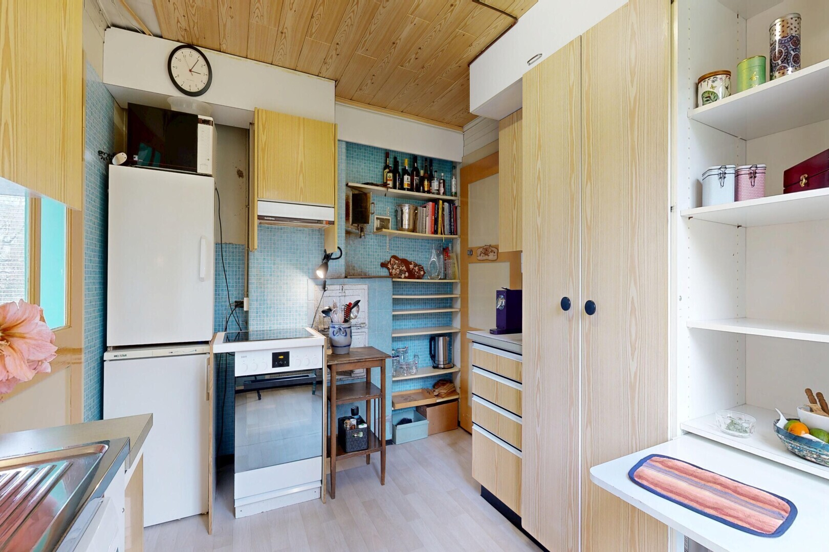 kitchen with light wood finish cabinetry, wood ceiling, backsplash, light wood-type flooring, and white appliances