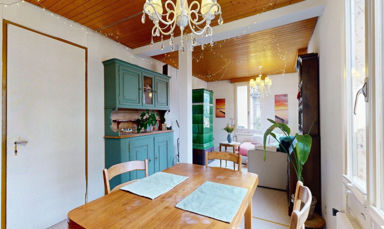 dining room featuring hanging lights, wooden ceiling, and radiator heating unit