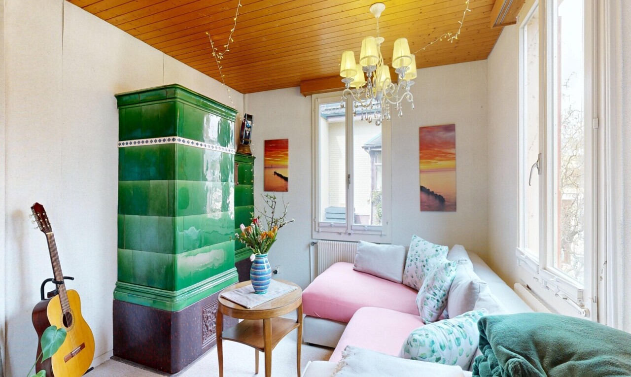 living room featuring a chandelier, wooden ceiling, and radiator