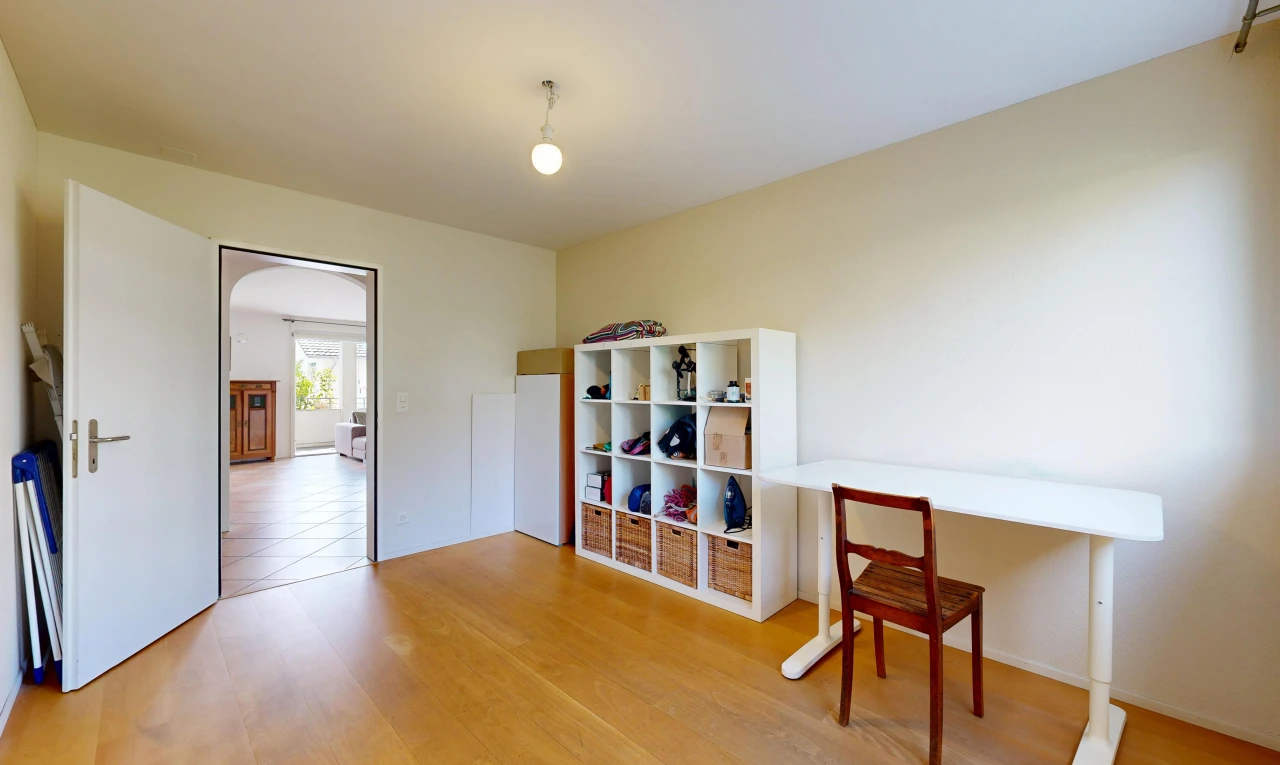 dining area with light wood-type flooring and arched walkways