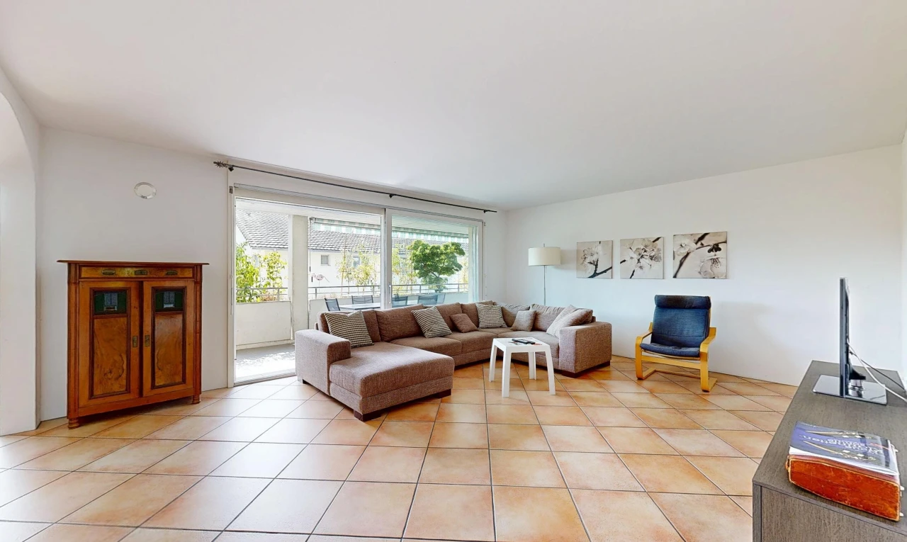 living area featuring light tile patterned flooring and access to outside